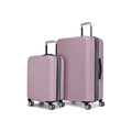 The Reebok Action Duo 2 Piece Luggage Set features two pink hard-shell suitcases with textured surfaces, white handles, dual spinner wheels, and the Reebok logo, all displayed against a white background.