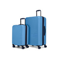 The Reebok Action Duo 2 Piece Luggage Set includes two blue hard-shell spinner suitcases with navy handles and trim, featuring the embossed Reebok logo on the front, shown upright on a white background.