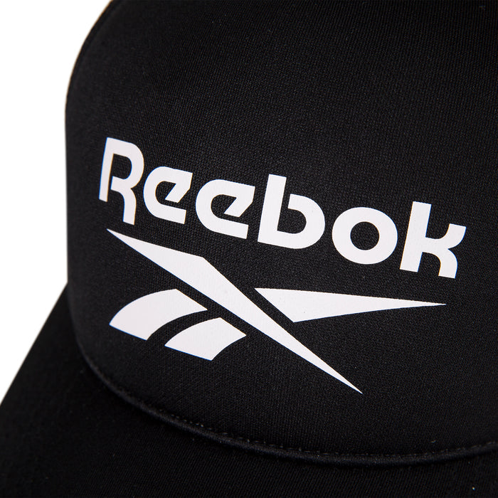 Close-up of the Reebok Aero Cap, a black athletic hat featuring a white Reebok logo and text on the front, crafted from moisture-wicking fabric for comfort.