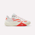 The Reebok Angel Reese 1 Shoes for big kids feature a white and light gray design with bold red and orange accents, a chunky sole, and dynamic wavy side details—perfect basketball sneakers for standout style and performance.