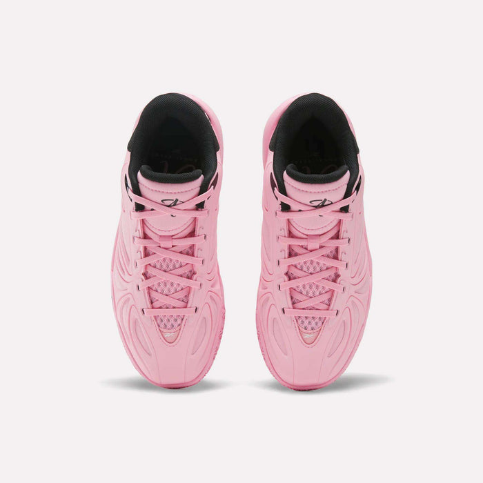 A pair of vibrant Angel Reese 1 Shoes - Big Kids by Reebok, these pink athletic sneakers with black interior linings are shown from above, highlighting the detailed patterns on the uppers and laced fronts—perfect basketball shoes for young athletes seeking both style and performance.