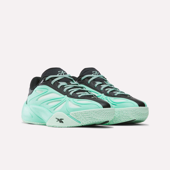 A pair of Reebok Angel Reese 1 Basketball Shoes for big kids in mint green and black, featuring a wavy pattern, light green laces, and a chunky sole, displayed against a plain white background.