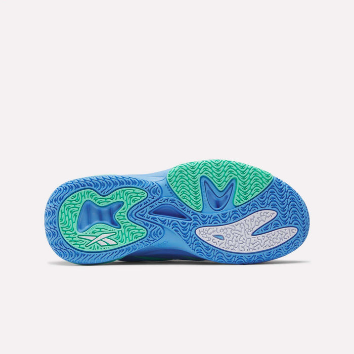 The image displays the sole of the Reebok Angel Reese 1 Shoes for big kids, showcasing blue, green, and light gray tread with wavy and textured patterns designed to enhance grip and traction on the court.