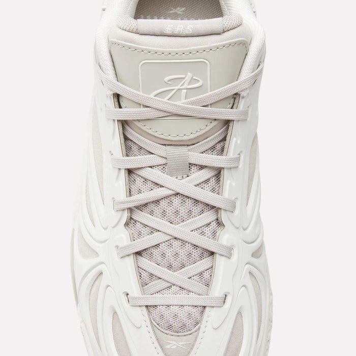 Top view of the Reebok Angel Reese 1 Basketball Shoes in white with textured mesh, light gray laces, molded side design, a stylized tongue logo, and Energy Return System for enhanced basketball performance.