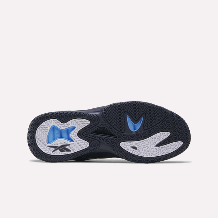 The image shows the outsole of the Reebok Angel Reese 1 Basketball Shoes, featuring a black base with wavy, textured tread. Blue and white rubber areas boost traction, while a stylized design highlights the Energy Return System at the center.