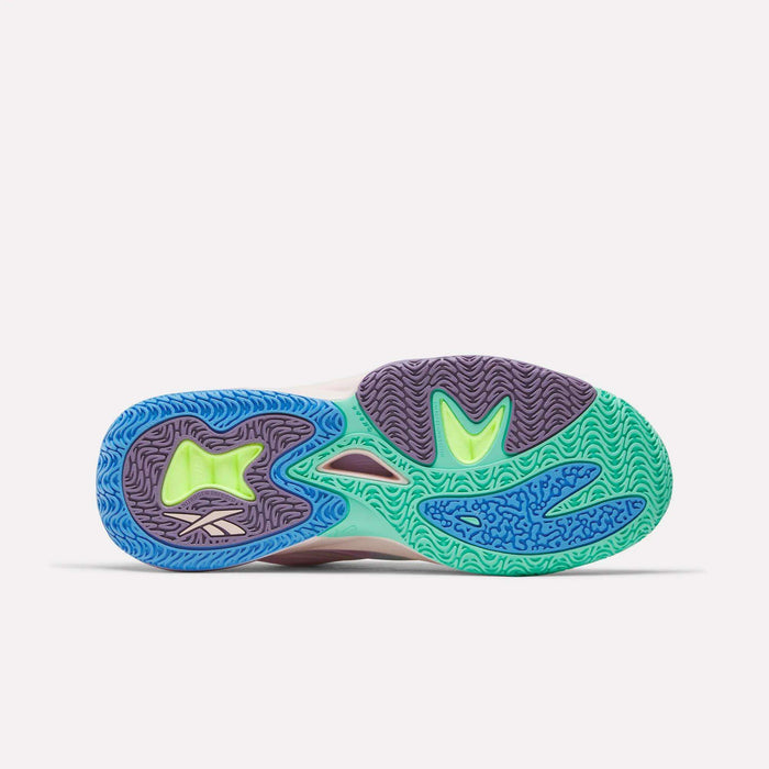 The image displays the vibrant sole of the Reebok Angel Reese 1 Basketball Shoes with intricate blue, green, purple, and yellow patterns and Energy Return System technology, set against a plain white background.