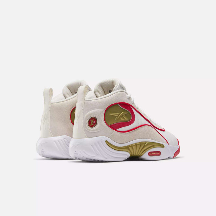 The Reebok Answer III Basketball Shoes in white and cream with gold and red accents feature a wavy sole and prominent side logos, shown against a plain white background.
