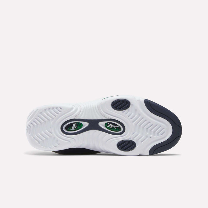 The image displays the sole of the Reebok Answer III Shoes, a retro basketball sneaker in white with navy and green accents, wavy tread patterns, and a central Reebok logo—a tribute to classic Allen Iverson style.