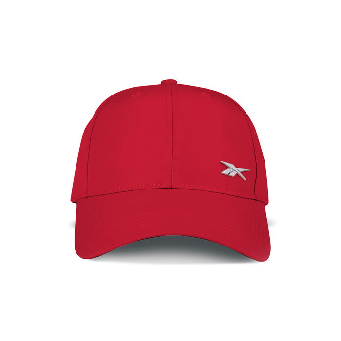 The Reebok Badge Cap in bright red is shown from the front, featuring a small white embroidered logo on the lower right crown and an adjustable buckle for comfort.