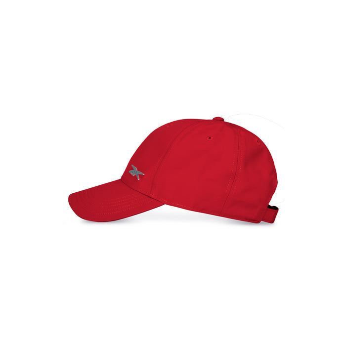 A vibrant red Reebok Badge Cap is shown in profile against a white background, featuring a silver logo on the side, curved brim, adjustable buckle strap at the back, and moisture-wicking fabric for comfort.