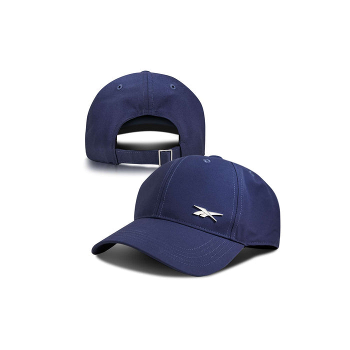A front and back view of the Reebok Badge Cap in navy blue. The front features a small white Reebok logo, and the back includes an adjustable strap.