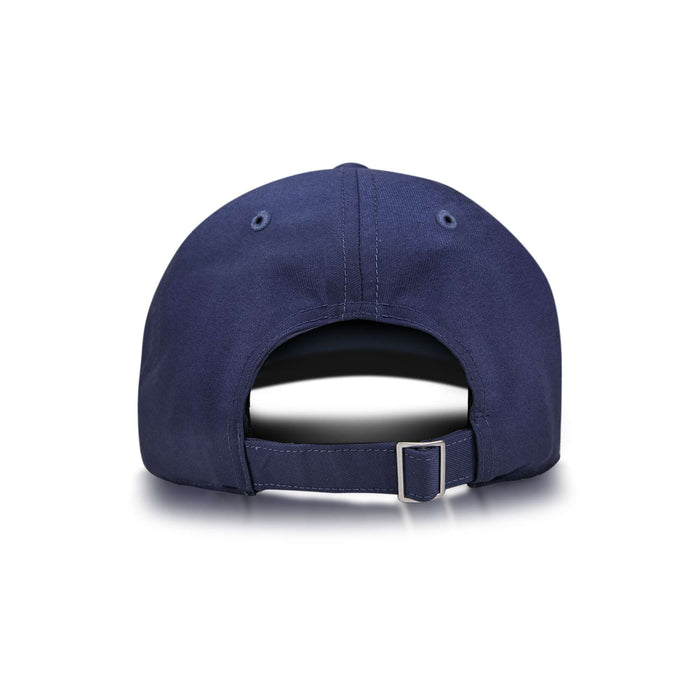 The Reebok Badge Cap is shown from the back in navy blue, with an adjustable strap and metal buckle, plus two ventilation eyelets on each side near the top. The background is plain white.