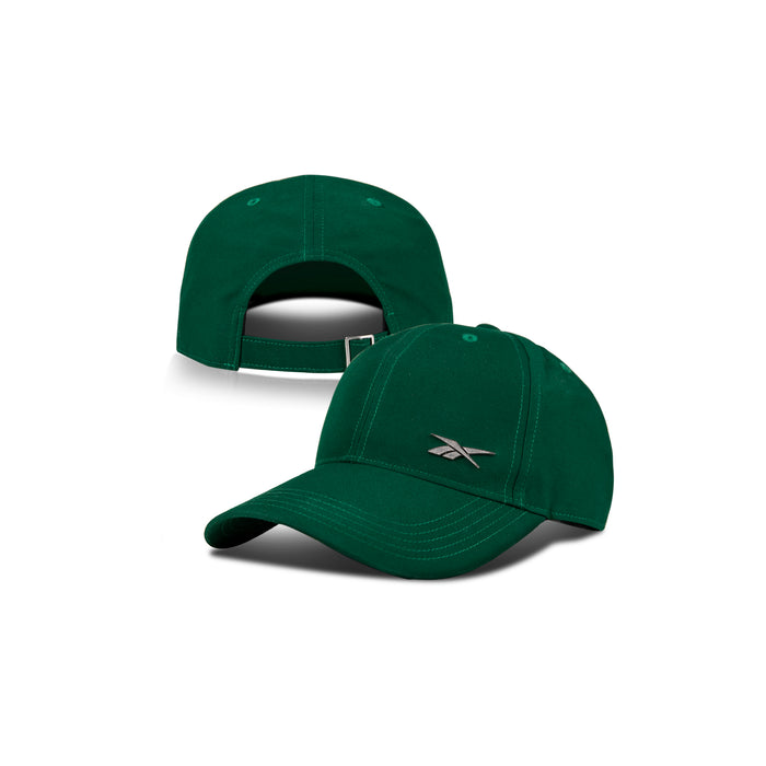 Two green Reebok Badge Caps are shown—one facing forward with a silver logo, the other backward to display an adjustable strap. Both highlight visible stitching and include a Speedwick sweatband for moisture-wicking comfort.