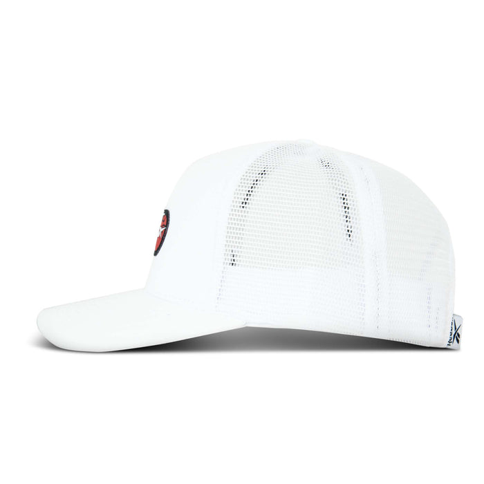 Side view of a white Reebok Basketball Trucker Cap with a curved brim and front embroidered patch. Features breathable mesh back panels, adjustable snapback closure, and fabric tag at the back.