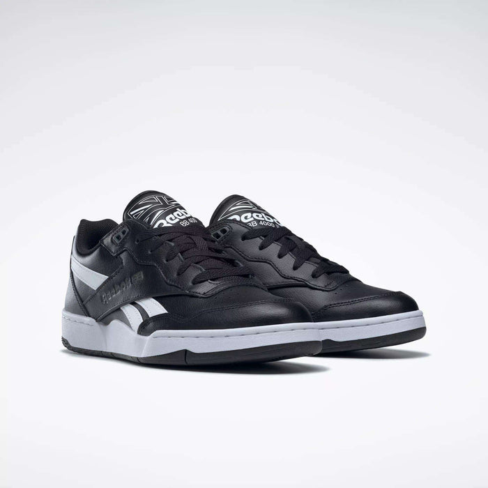 A pair of Reebok BB 4000 II Shoes in black with white soles and silver accents, featuring the Reebok logo on the side and tongue, shown against a plain white background.