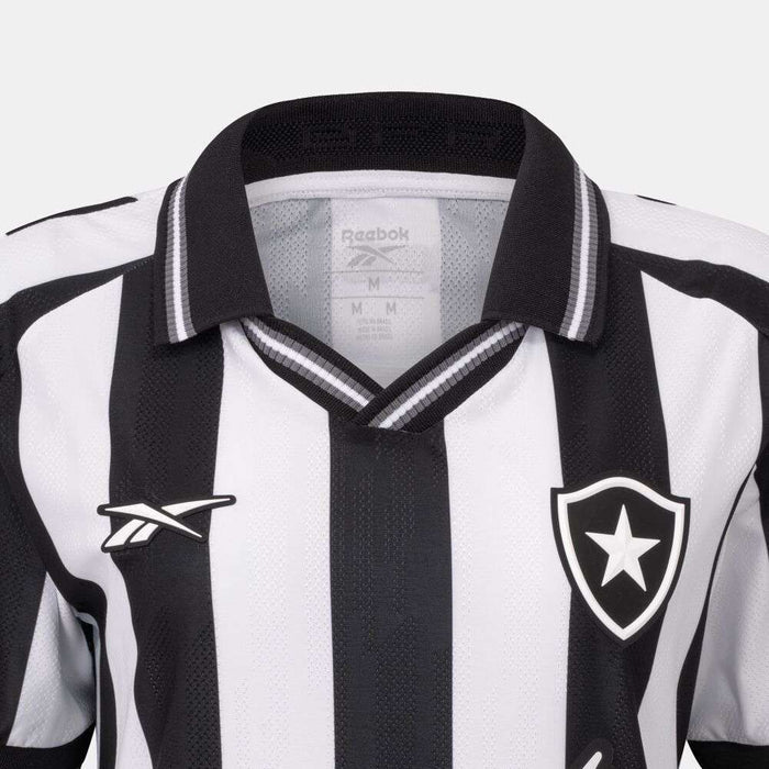 Close-up of the Botafogo Women's Home Jersey by Reebok, featuring black and white stripes, a star inside a shield on the left chest, and a black collar—perfect for the 25/26 football season.