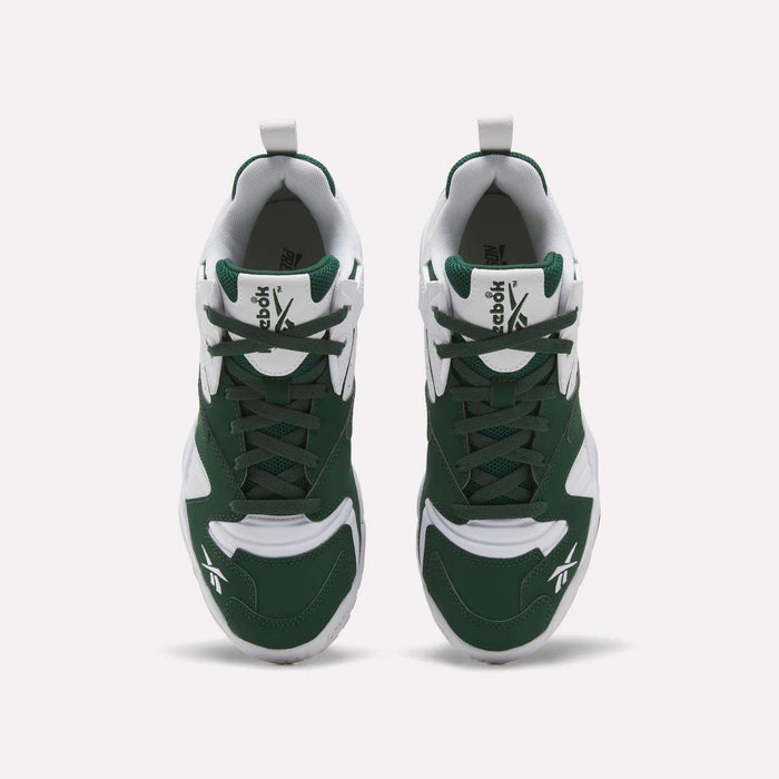 A pair of Brutus Low Shoes by Reebok in green and white is displayed from above, highlighting the laces, tongue, and signature logo on each shoe against a plain white background. Inspired by 90s style, these sneakers feature a lightweight EVA midsole for all-day comfort.