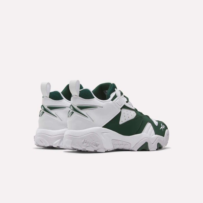 A pair of Brutus Low Shoes by Reebok in chunky green and white, viewed from the back left side, feature textured soles, Reebok logos, and layered panel details—these 90s-inspired sneakers include a lightweight EVA midsole for enhanced comfort while showcasing classic Reebok heritage style.