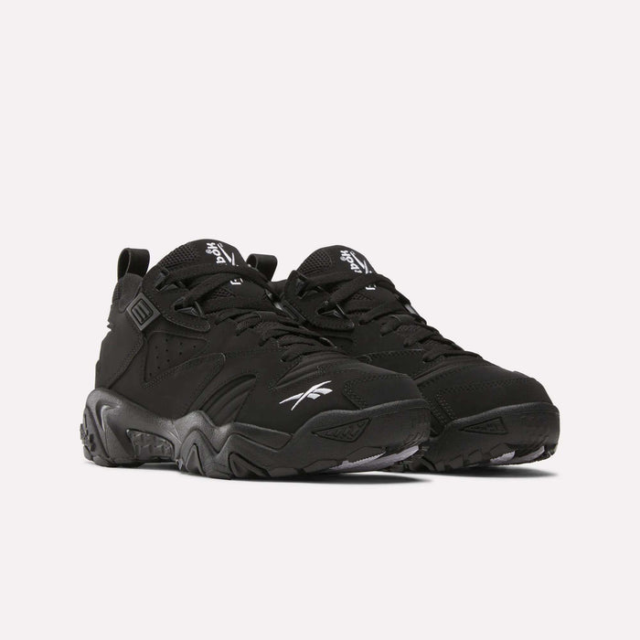 A pair of Brutus Low Shoes by Reebok, featuring chunky soles and white logos for street-ready style, showcased on a plain light background.