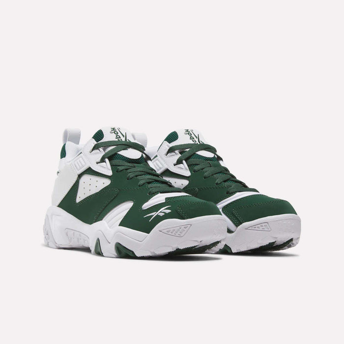 A pair of Reebok Brutus Low Shoes in green and white, inspired by 90s heritage style, displayed on a white background and positioned at an angle to showcase both the side and front views.