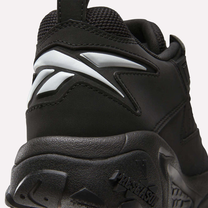 Close-up of the heel and sole of the Reebok Brutus Low Shoes in black, featuring a white Reebok logo and textured outsole—ideal for adding street-ready style to your outfit.