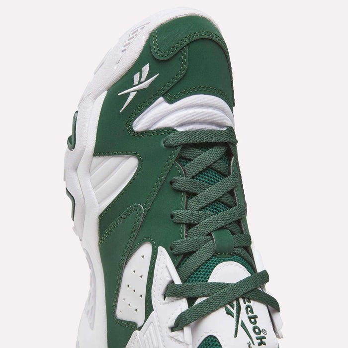 A close-up of the Reebok Brutus Low Shoes in green and white, highlighting the laces, logo, and details of the upper and sole. Inspired by 90s heritage design, these shoes feature an EVA midsole for lightweight cushioning and classic Reebok style.