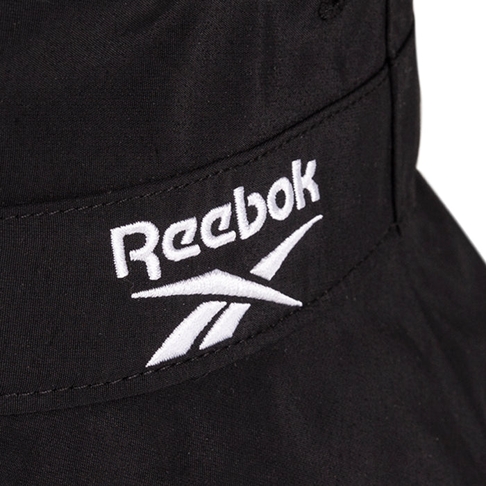 Close-up of a black Reebok Bucket Hat with the white embroidered Reebok logo and text.