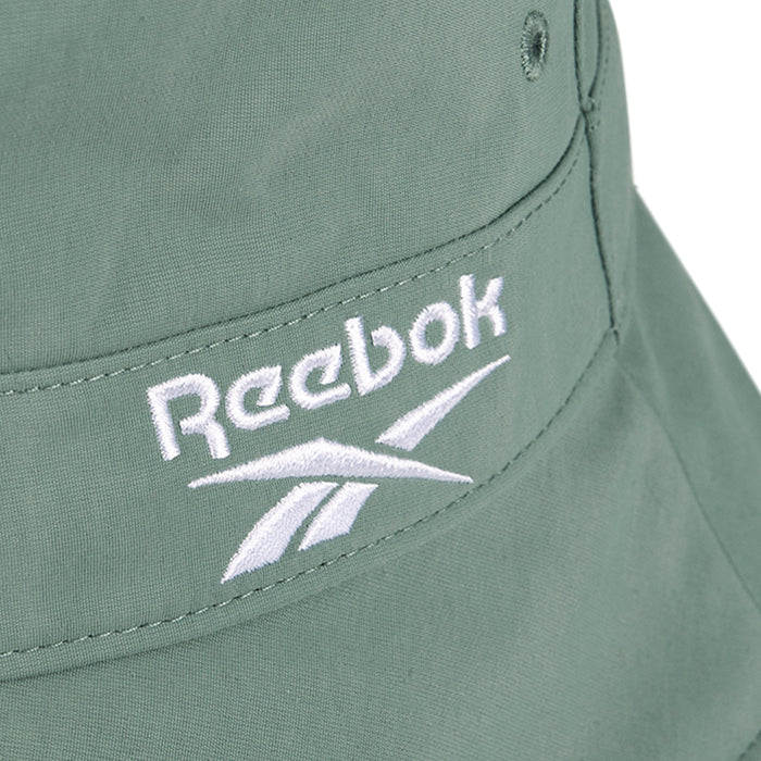 Close-up of a sage green Reebok Bucket Hat, made from recycled nylon and finished with a white embroidered Reebok logo.