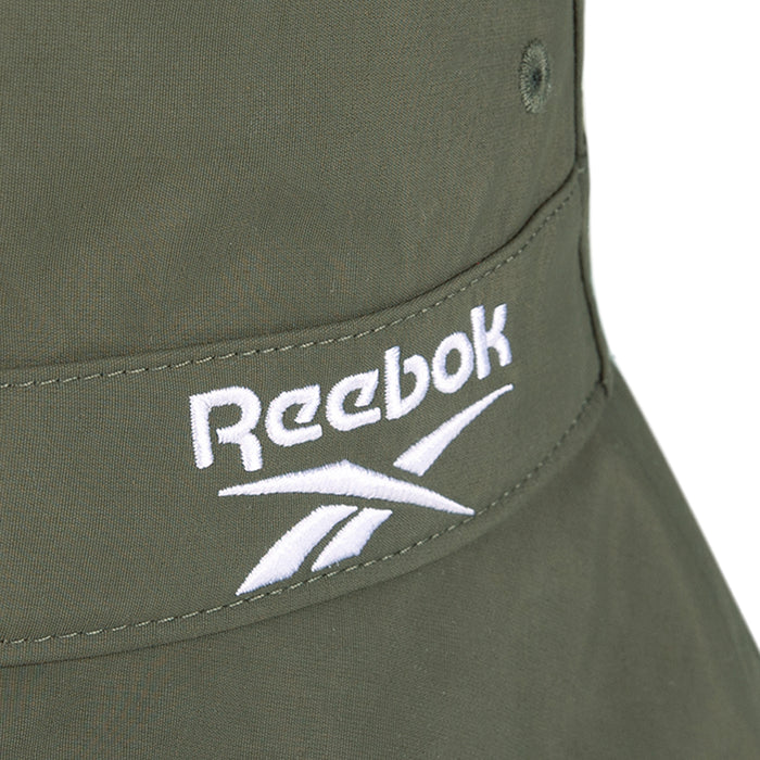 Close-up of a Reebok Bucket Hat in olive green, made from recycled nylon and featuring the white embroidered Reebok logo—a stylish choice for eco-conscious streetwear fans.