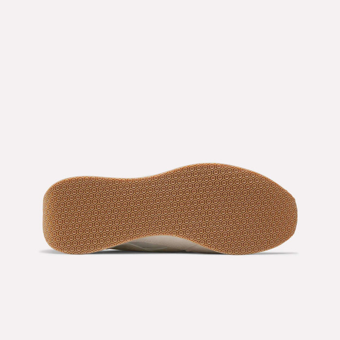 The image displays the bottom of a Reebok Camargue shoe, highlighting its light brown textured rubber sole with a repeating circular pattern against a plain white background.