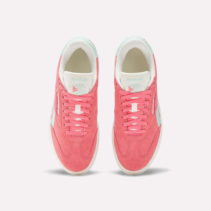 Top view of a pair of Reebok Campio Extra Women's Shoes in pink with white platform midsoles, pale blue accents, and white interior lining, displayed side by side on a plain light background.