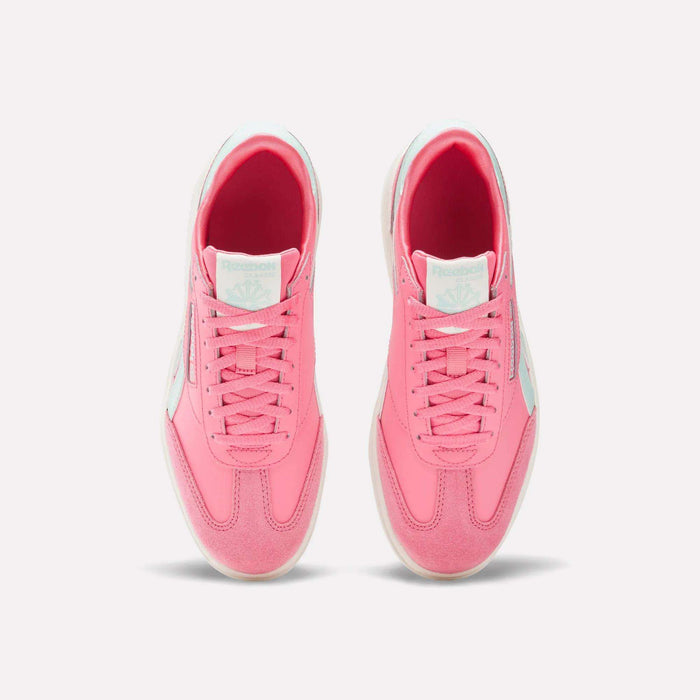 Top view of Reebok Campio XT Double Shoes for big kids in bright pink with white soles, blue logos on the tongue, and white side accents—perfect retro sneakers for girls—displayed on a plain white background.