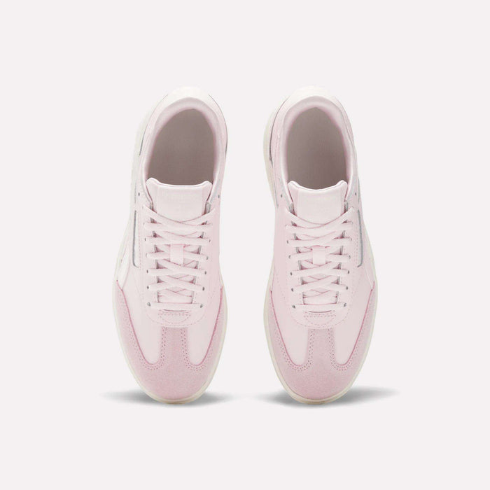 The Reebok Campio XT Double Shoes - Big Kids are stylish pink and white retro sneakers, perfect for girls.