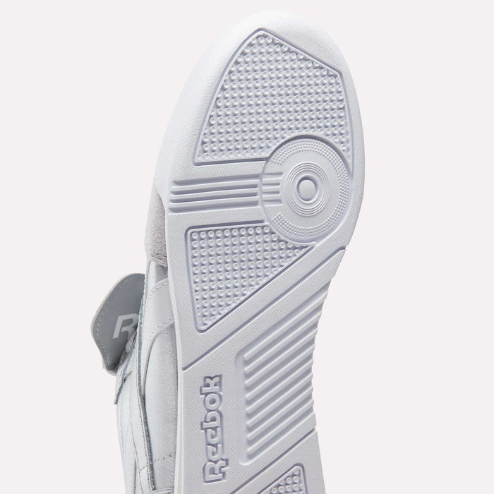 Close-up of the white sole on Reebok Campio XT Kilty Shoes, highlighting the detailed tread and embossed Reebok logo near the heel—a tennis-inspired feature of classic Reebok design.