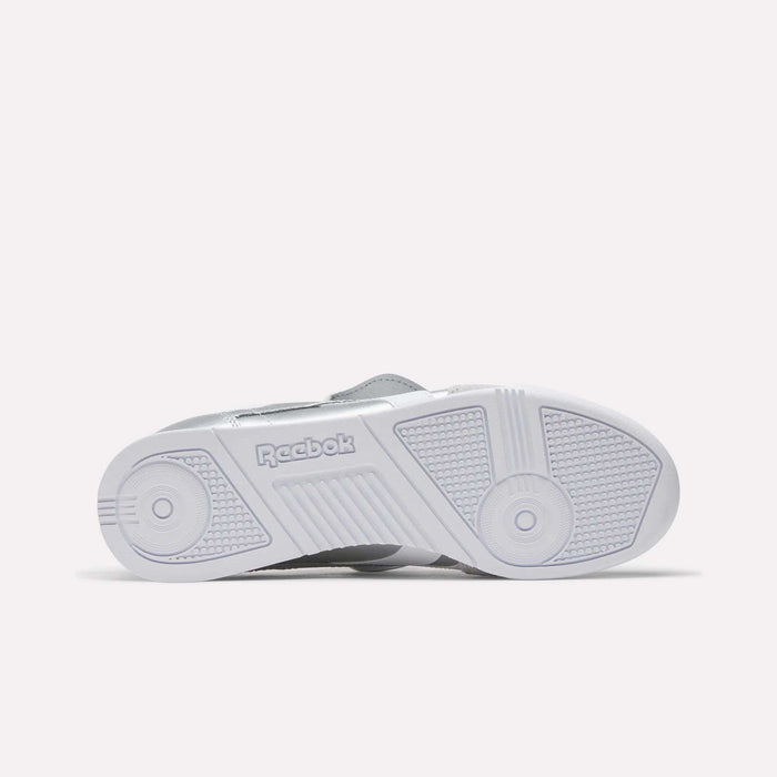 The image shows the sole of Reebok Campio XT Kilty Shoes, displaying the Reebok logo and light grey geometric traction patterns that evoke classic tennis-inspired style.