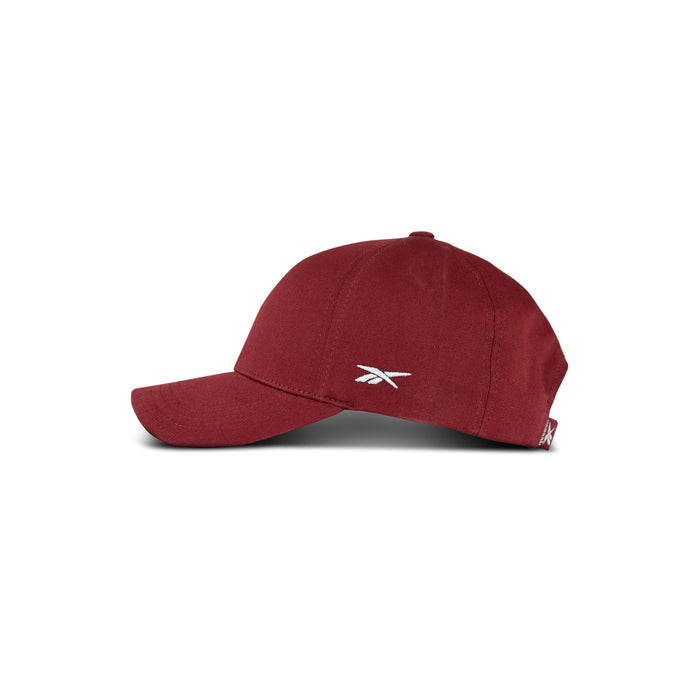 The Chroma Cap by Reebok is a maroon cotton twill snapback hat with a curved brim and small white logo on the side, shown on a plain white background.