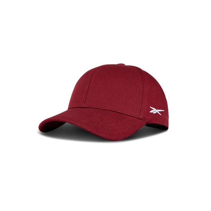 The Reebok Chroma Cap is a maroon cotton twill hat with a curved brim, a small white embroidered logo on the left, and an adjustable snapback for fit. Displayed on a white background.