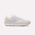A single Reebok Classic AZ Shoe for big kids in pastel purple with light yellow accents, white laces, foam cushioning, a white midsole, and a tan rubber outsole—displayed on a plain white background.