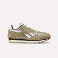 The Reebok Classic AZ Shoes for big kids feature a tan upper with black spots, white laces, and white Reebok logos. These low-top sneakers have a black and gum sole for a retro look—perfect for junior girls seeking style.