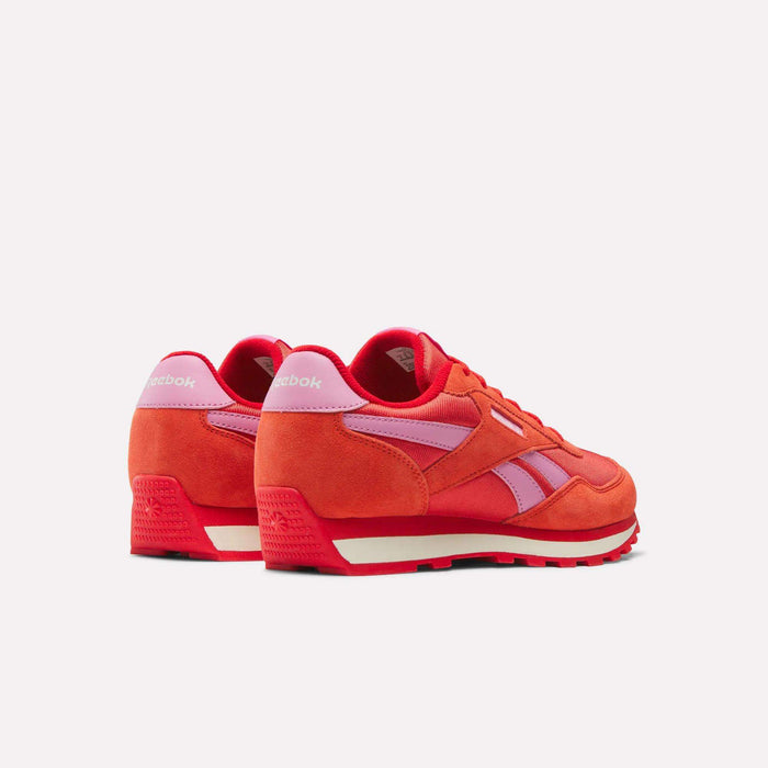 The Reebok Classic AZ Shoes for big kids feature a bright red suede and mesh upper with pink accents, white midsoles, and red outsoles—ideal for junior girls who want standout retro style.