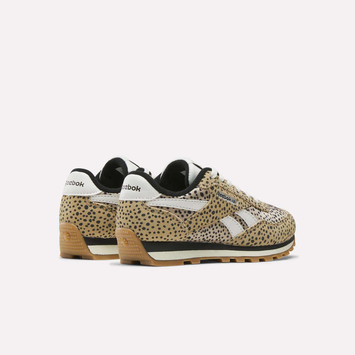 Two pairs of Reebok Classic AZ Shoes - Little Kids display a tan and black spotted pattern with white details and midsoles. Shown at an angle, the shoes highlight side and back views against a plain white background.