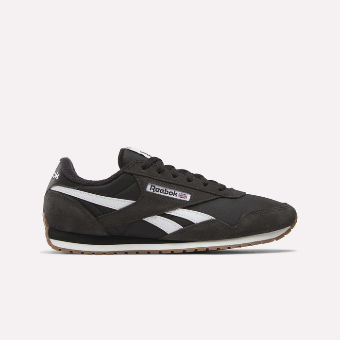 The Reebok Classic AZ Shoes in black feature white and gray accents, white side stripes, and a brown rubber sole that channels true '70s style, shown against a plain light background.