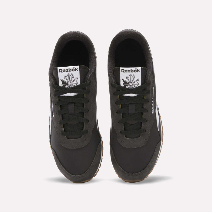 Top view of Classic AZ Shoes by Reebok—black retro running shoes with white tongues displaying the Reebok logo and star, black laces, and gum-colored outsoles—showcasing '70s-inspired style on a white background.