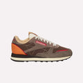 The Reebok Classic Leather Premium LTD Shoes feature a brown and taupe colorway with red and orange accents, white stitching, classic silhouette, white laces, black and white sole, and visible Reebok logos for a retro sneaker vibe.