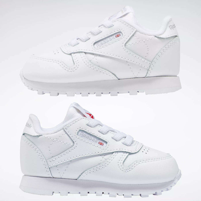 Two pairs of Reebok Kids' Classic Leather Shoes for babies and toddlers are displayed side by side against a plain background, showcasing their signature branding and detailed stitching.