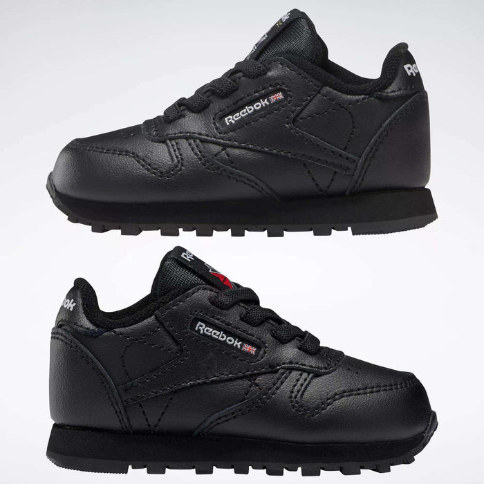 Two pairs of Reebok Kids' Classic Leather Shoes for babies and toddlers are displayed side by side on a white background, showcasing their classic sneaker design and signature branding.