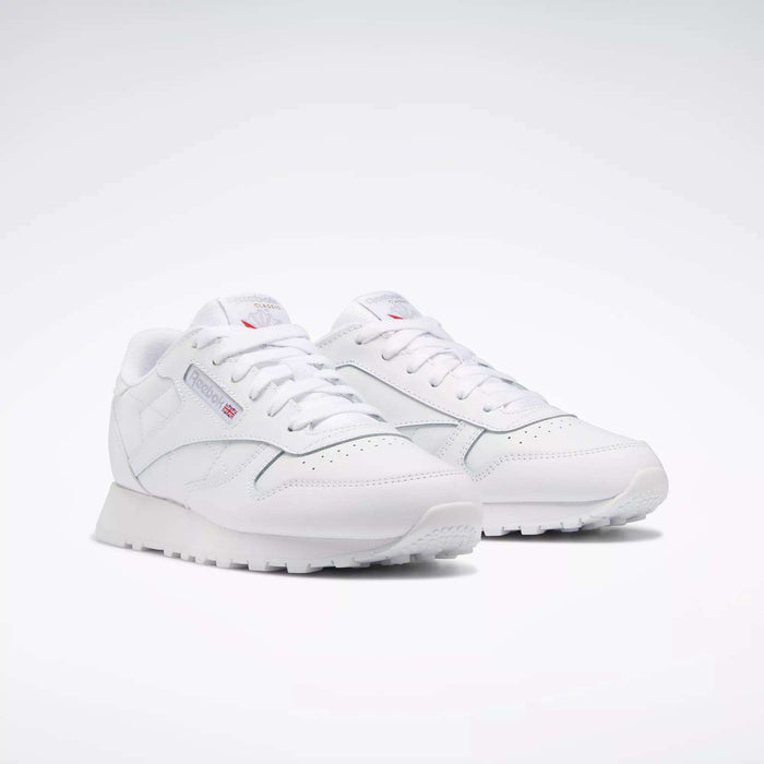 The Reebok Classic Leather Shoes - Big Kids feature a timeless white design with white laces and subtle side and tongue branding—ideal for those who appreciate classic style.