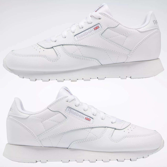 Two white Reebok Classic Leather Shoes - Big Kids are displayed side by side on a plain white background, showcasing the signature design and Reebok logo—ideal as stylish footwear for junior boys.