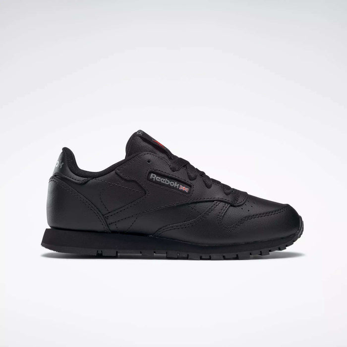 The Reebok Kids' Classic Leather Shoes - Preschool feature a black leather upper, low-top silhouette, lace-up closure, and subtle side branding, shown against a plain white background.