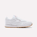 The Reebok Classic Leather Shoes feature a low profile, white leather upper, white laces, and retro gum rubber sole, shown in a side view against a plain light background.